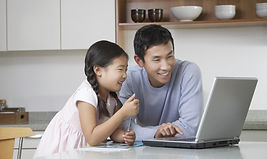 Father and daughter at computer_edited.j