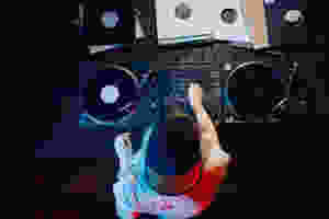 DJ turning knobs on turntables