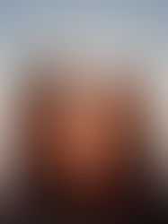 Two people sitting together watching a sunset at the end of summer, reflecting on seasonal transitions and managing end-of-summer stress.