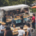 people being served plated food,from a large food truck outdoor background during natural