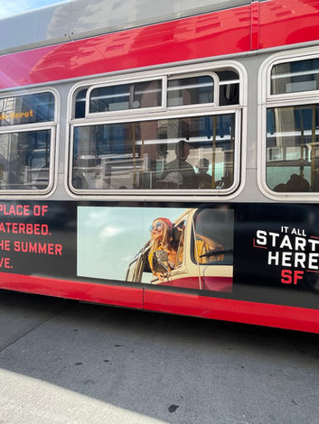 It Starts Here SF campaign photo showing bus with decal.