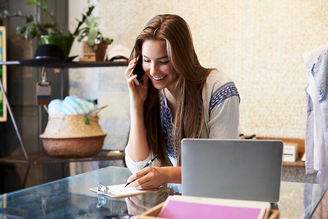 young-woman-working-clothing-store-takes-phone-enquiry_625516-3735.png