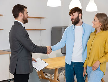 male-real-estate-agent-doing-business-showing-house-potential-buying-couple.jpg