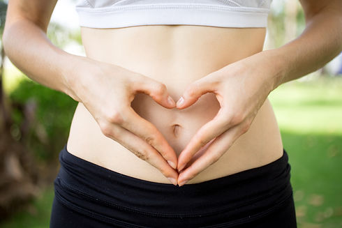 close-up-female-hands-shaping-heart-belly.jpg