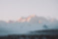 landscape-hills-forests-covered-snow-sunlight-cloudy-sky.jpg