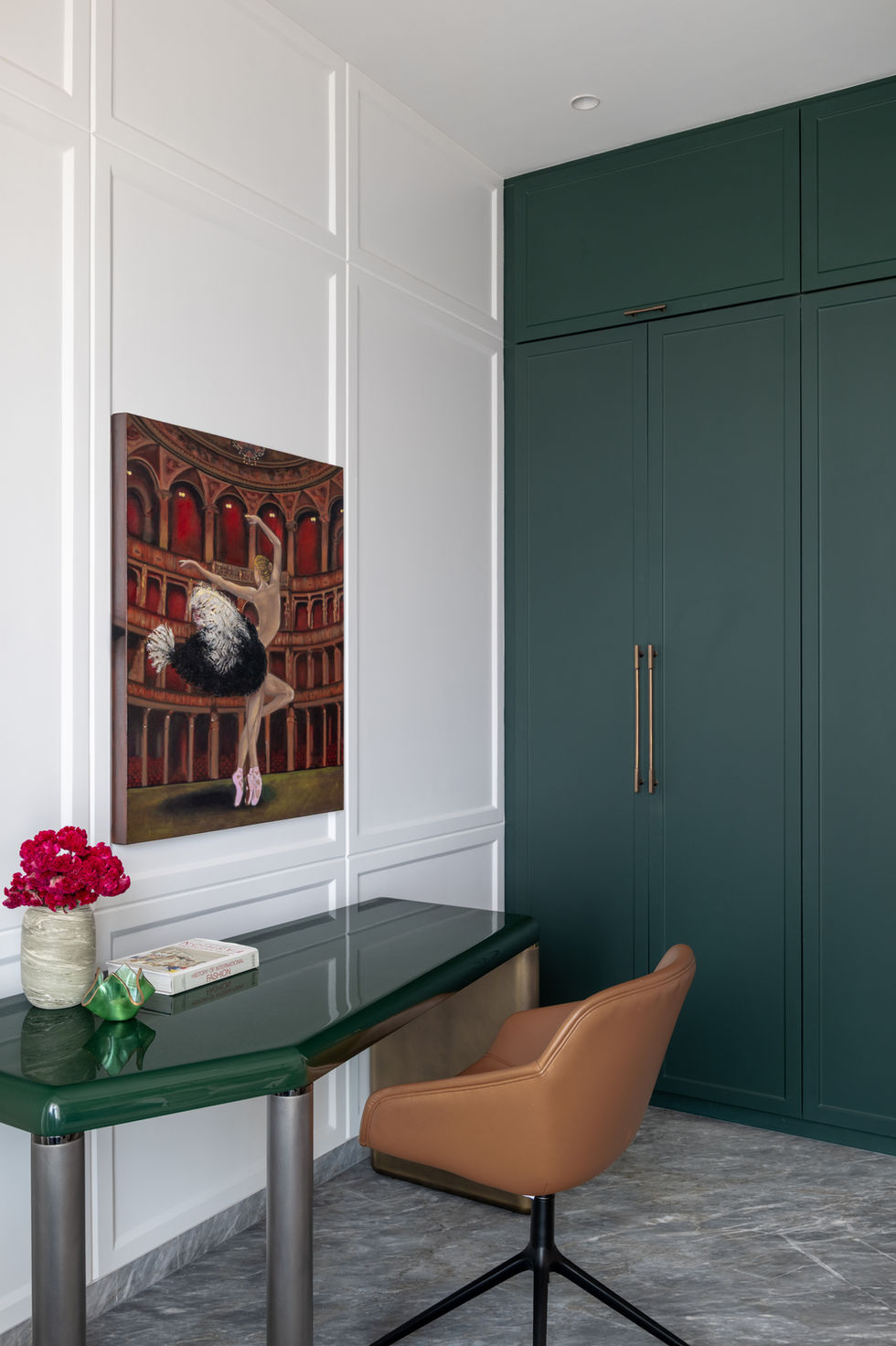 Elegant room with painting, desk, and chair.