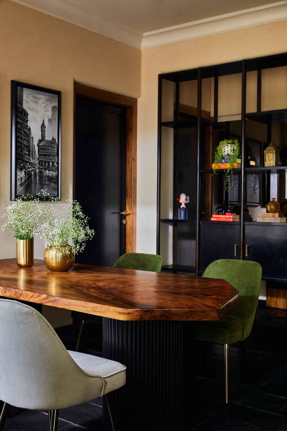 a black and white photo of a city is above a wooden table