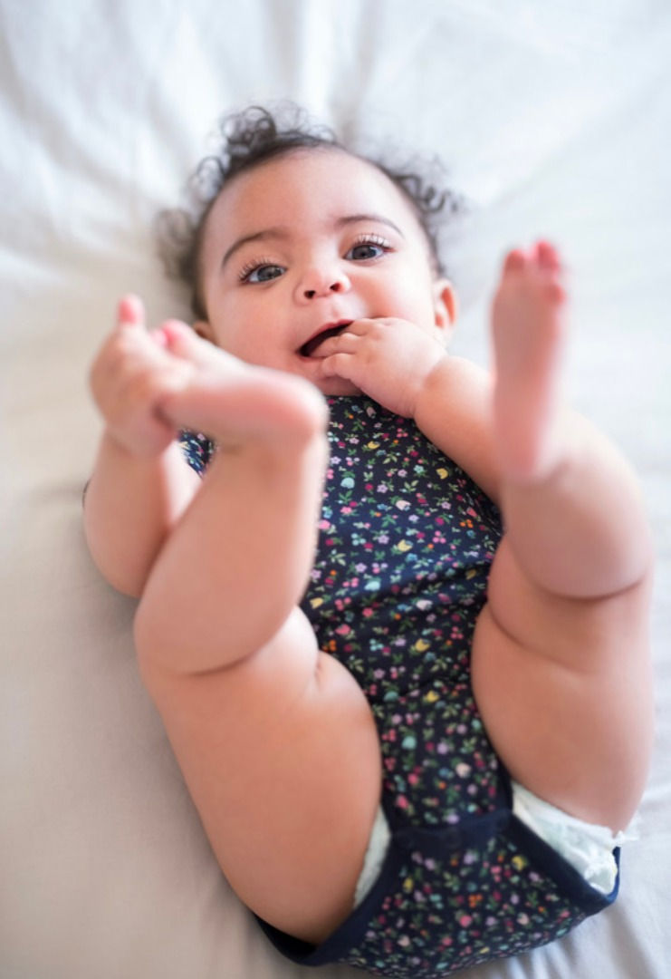 Cute baby wide awake in crib