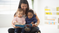 children reading a book at daycare