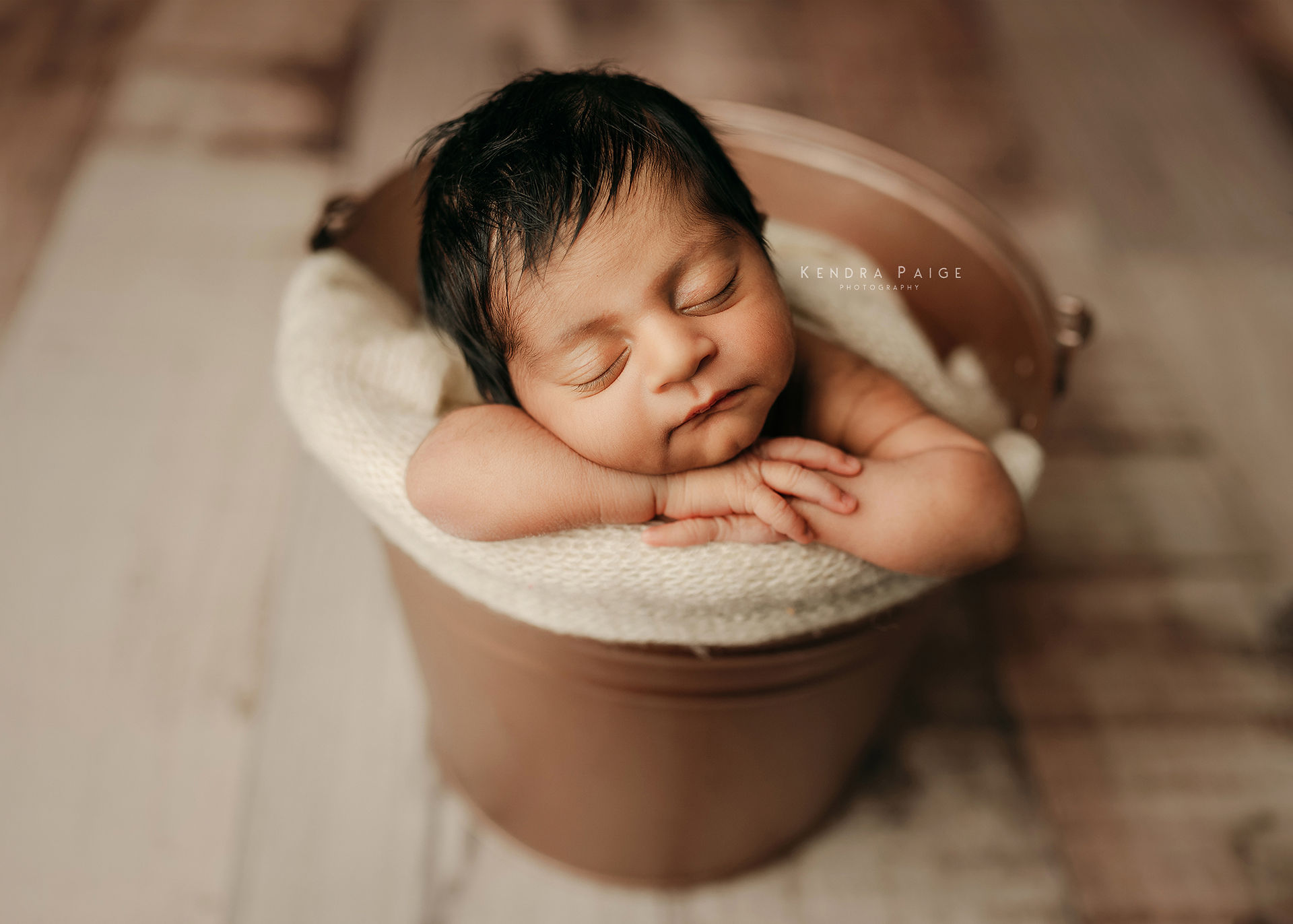 Airdrie newborn photographer bucket pose