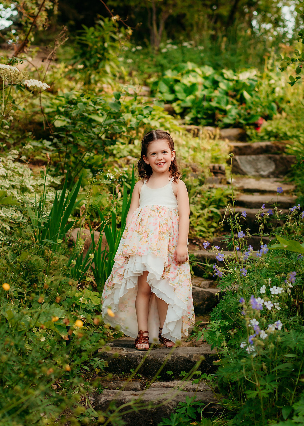 girl in floral sundress by family photographer in Calgary Alberta