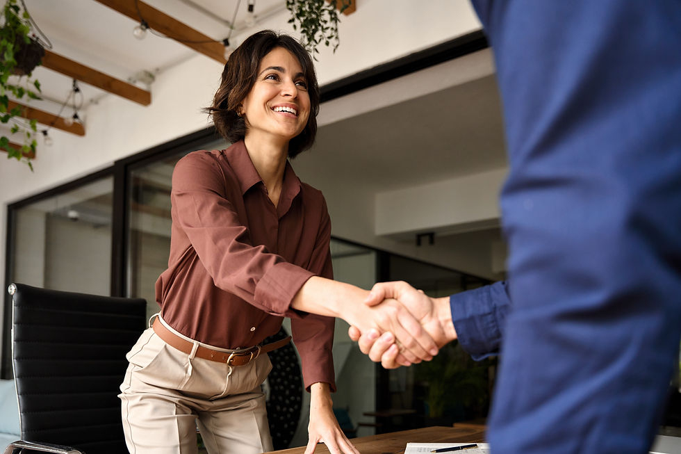 Handshake of happy young business woman and business man at office meeting Female hr bank