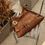 Thumbnail: "Together in electric dreams" shoulder bag, chocolate suede