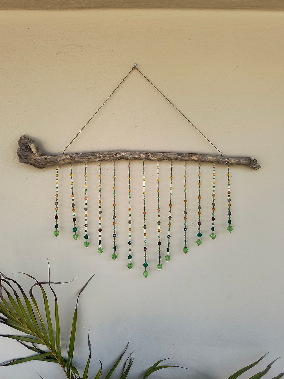 Large handmade driftwood suncatcher with green Czech glass beads.