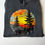 Thumbnail: Dark grey poly hoodie. Forest sunset with birds.