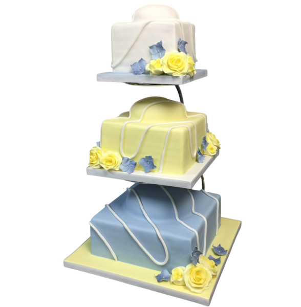 Three-tiered wedding cake with pastel sugar paste and elegant floral decorations.