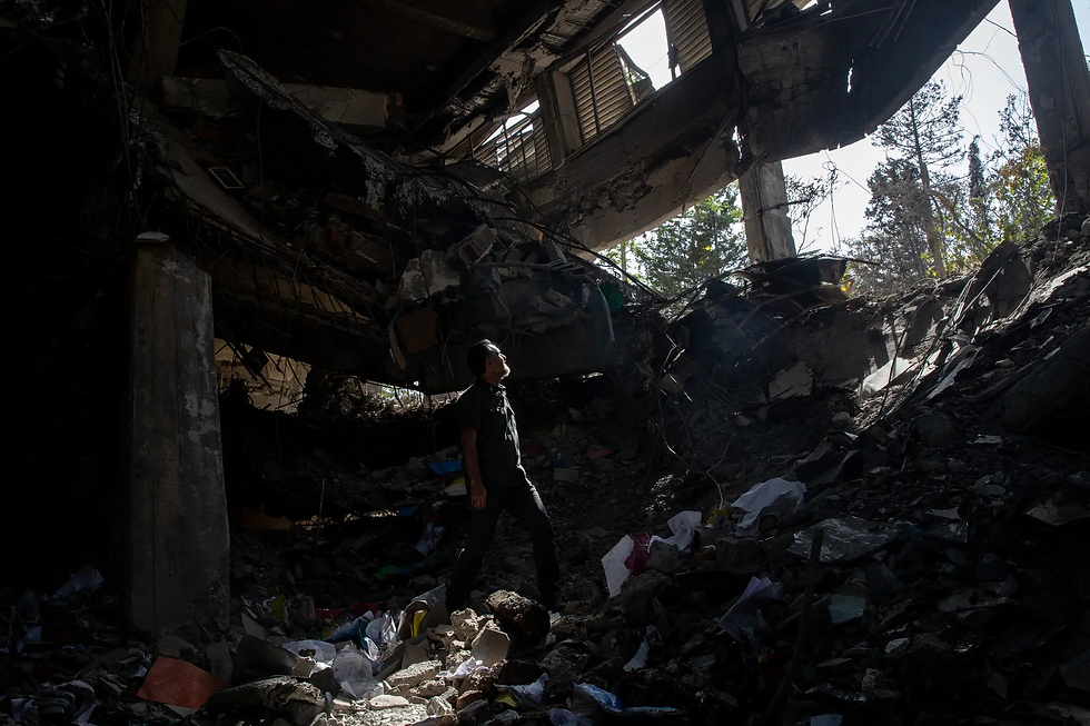 A crater caused by an Israeli missile strike on the administrative office inside Evin prison. The attack happened at noon during working hours and family visitation time. Credit: Arash Khamooshi for The New York Times