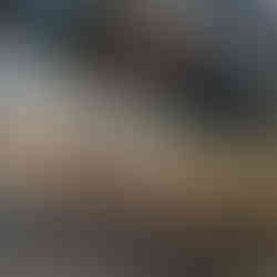 Poke bar with multiple types of poke shown behind glass at restaurant