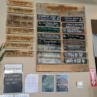Large menu shown up on the wall.  At top of menu, states "Grand Canyon Brewing Co".