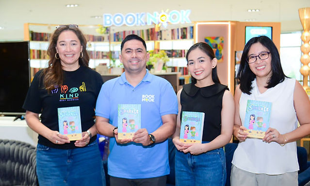 Michelle Aventajado, Richard Caluyo, Arianne Reyes, as  Katrina Gutierrez turns over copies of One Extra Sparkle: Ellie and the Marriage List to the SM BOOK NOOK. One Extra Sparkle is the first early fiction series featuring a child protagonist who has Down Syndrome. The series' first book, "Ellie and the Marriage List," stars Ellie, a neurodivergent 10- year-old "whose extra sparkle never fails to shine bright," embarking on a summer adventure full  of friendship and self-discovery.