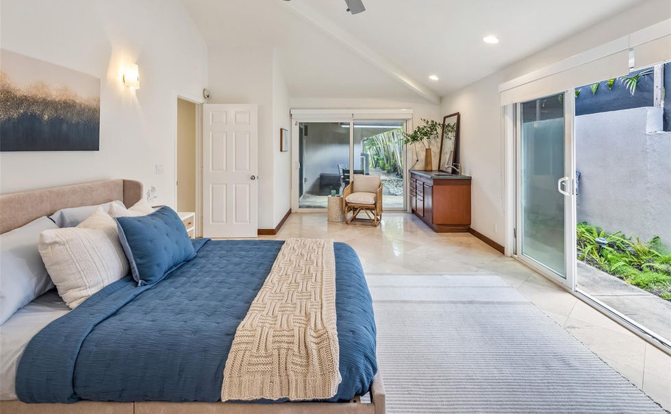 Secluded retreat with ocean vibes: Wood accents, bright interiors, and lush tropical backdrop.