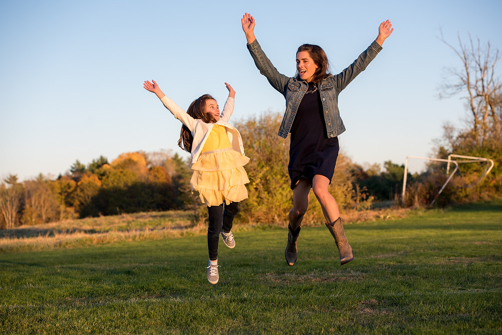 mom and daughter jumping