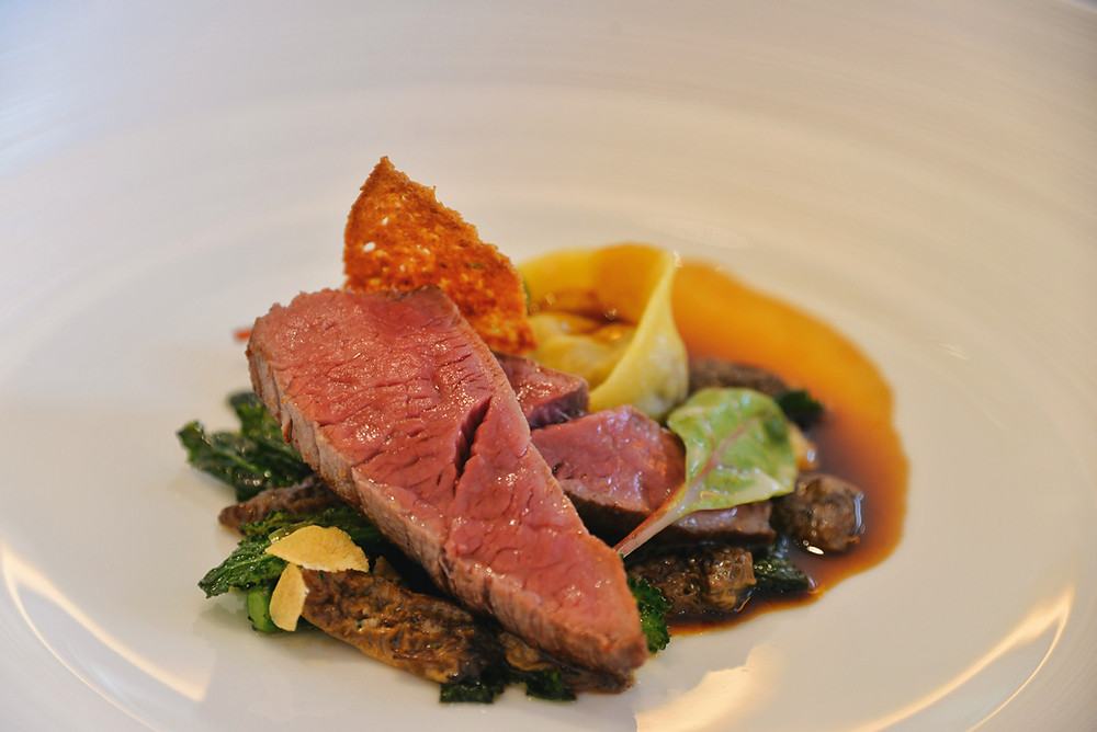 Canadian bison fillet, palm tree kale, black morels and young garlic
