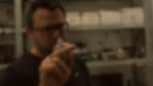dr Zee drawing molecule on glass