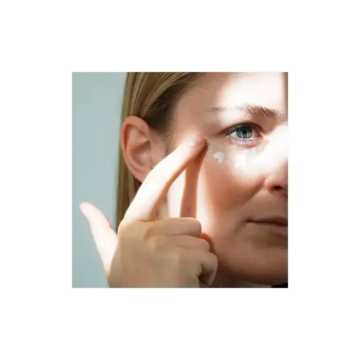 Applying Dr Schrammek Sensiderm Eye Balm to the under eye area