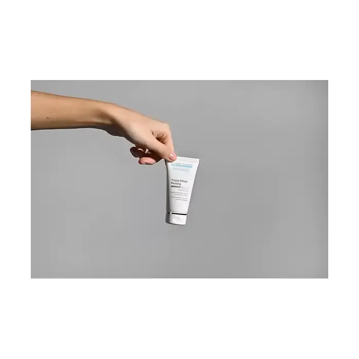 Dr Schrammek Triple Effect Peeling 50ml held in hand demonstrating compact tube size