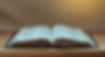 open-bible-on-a-wood-table-with-light-from-window-2023-11-27-05-20-36-utc.jpg