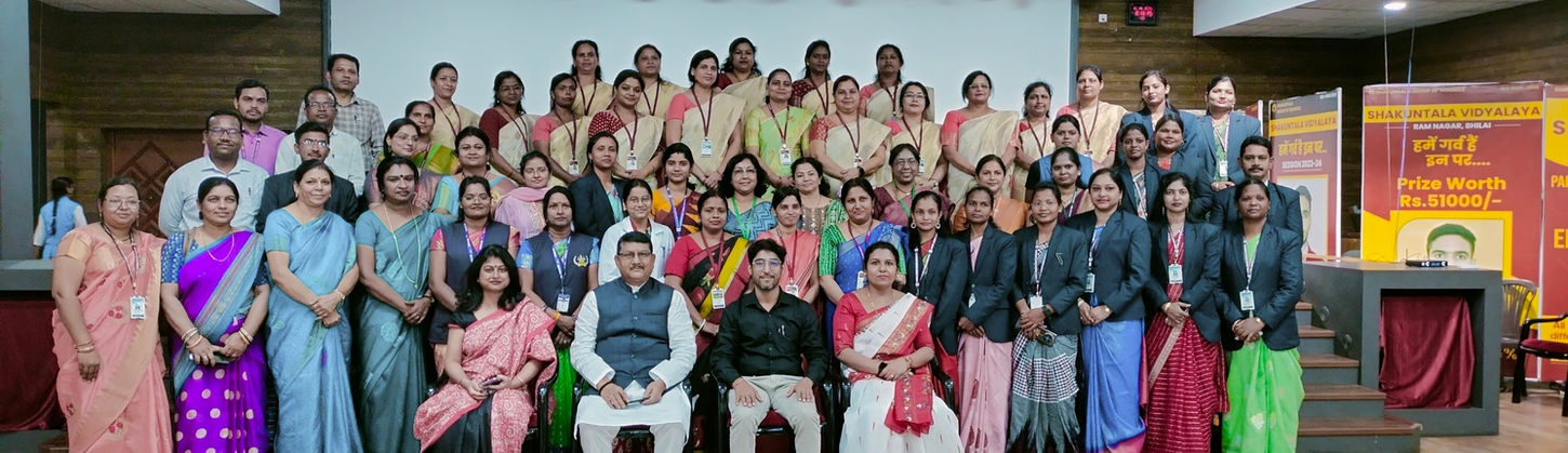Group photo in traditional and festive attire at a school cultural program