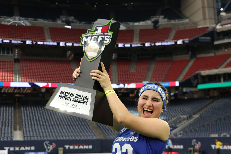 Abril Hernández holding the trophy at the Mexican College Football Showcase
