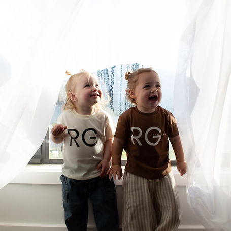 Pictured two children wearing the basic tee