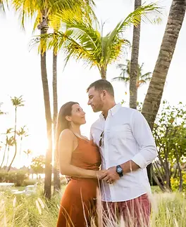 Wedding photographer capturing a couple on the beach in Aruba at sunset.