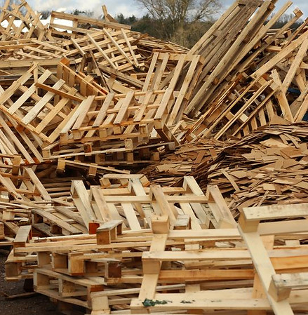 Wooden pallets stacked up in a pile