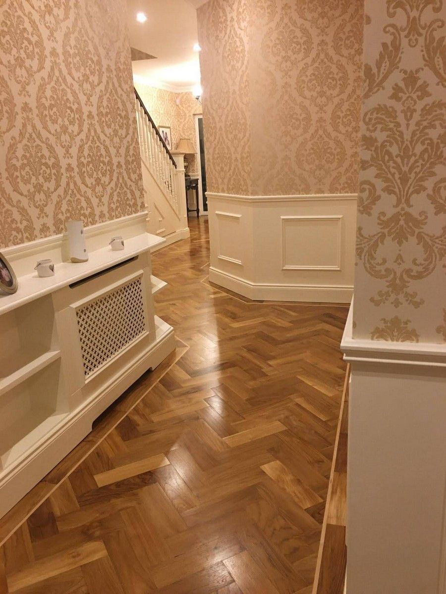 Solid teak herringbone with maple inlay on traditional hallway