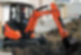 A mini digger digging up a garden