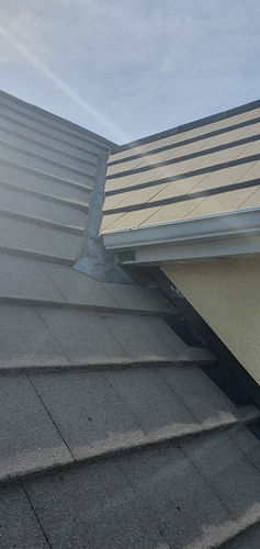 Close-up of gray and beige roof shingles