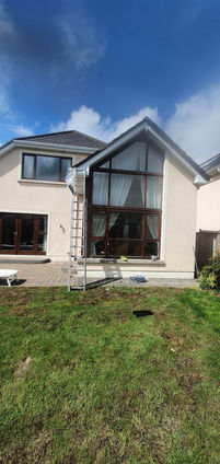 Modern house exterior with large windows
