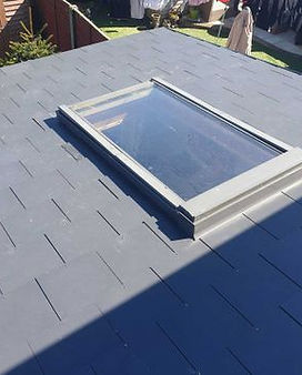 Grey shed roof with a skylight
