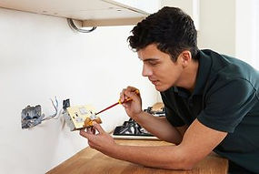 Electricians rewiring a plug