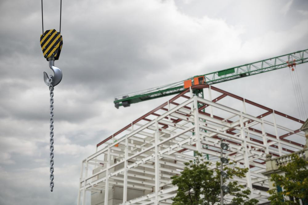 Studio Shoot of a crane lifting hook against crane at the construction site.
