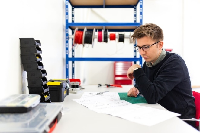 A safety engineer reading a crane load chart