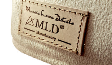 Picture of our handcrafted Loudspeaker Cover with leather touch in creme beige
