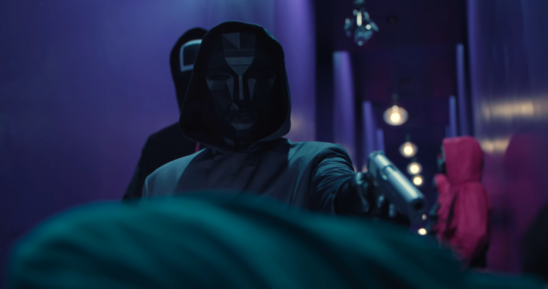 a screenshot of the Front Man pointing a gun