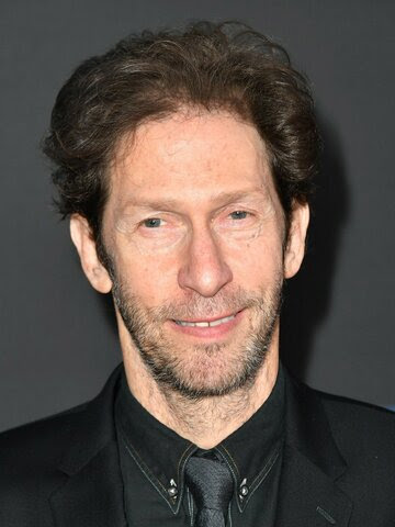 a picture of Tim Blake Nelson smiling