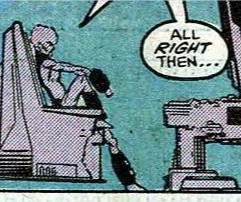 Sam sitting with a foot on his chair, his arm resting on this knee, the other foot on the ground