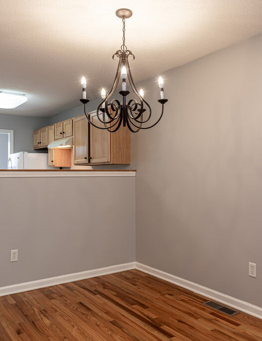 Pine Meadows living room with Chandelier