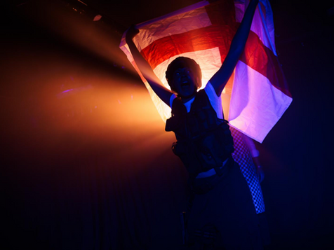 Person waving a flag - the Cross of St George